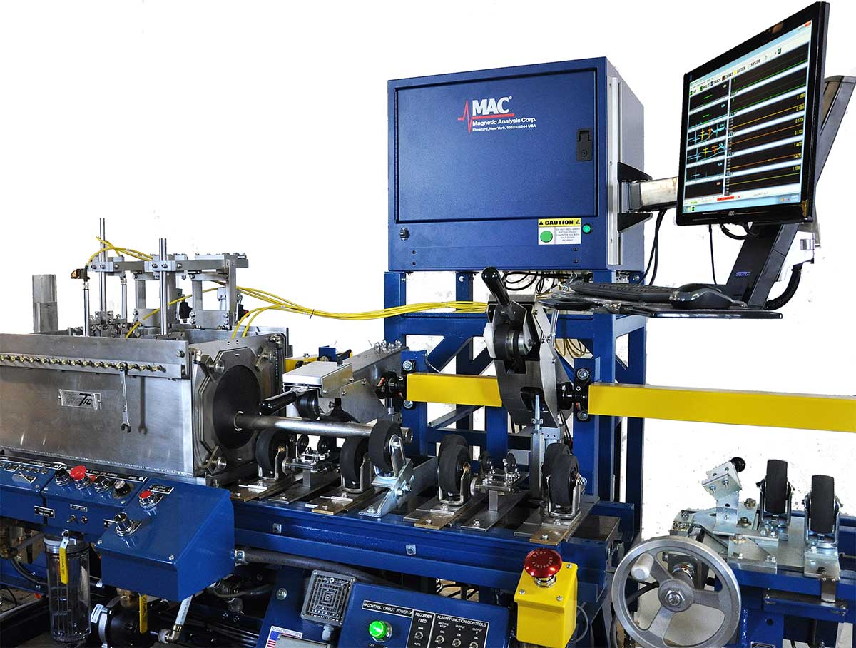 Ultrasonic Test System for Titanium Tube -
TACTIC UT immersion tank containing the transducers which feed directly to the FD-6A is at lower left. MAC's Echomac® FD 6A UT instrument is at center.