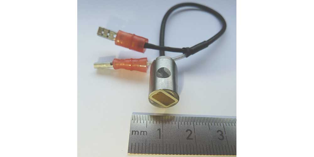 photograph of a line focused ultrasonic transducer for installation in Slicker's ROTA25 rotary inspection head